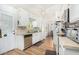Bright kitchen with white cabinets, stainless steel appliances, and wood floors at 2650 W Union Hills Dr # 155, Phoenix, AZ 85027