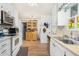 Kitchen with white cabinets, wood flooring and a hutch at 2650 W Union Hills Dr # 155, Phoenix, AZ 85027