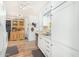 Kitchen with white cabinets, wood flooring and a hutch at 2650 W Union Hills Dr # 155, Phoenix, AZ 85027