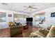 Bright living room with hardwood floors, large windows, and ample seating at 2650 W Union Hills Dr # 155, Phoenix, AZ 85027