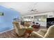 Open living area with hardwood floors, comfortable furniture, and a view of the dining area at 2650 W Union Hills Dr # 155, Phoenix, AZ 85027