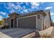 Single story home with stone accents and landscaped yard at 26733 W Melinda Ln, Buckeye, AZ 85396