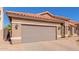 Single-story home with a two-car garage and desert landscaping at 2852 W Gail Dr, Chandler, AZ 85224