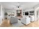 Bright living room features a cozy fireplace and built-in shelving at 2909 N 90Th St, Mesa, AZ 85207