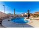 Stunning kidney-shaped pool surrounded by a large patio and lush landscaping at 3925 W Charter Oak Rd, Phoenix, AZ 85029