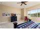 Bedroom with mountain views and a red rocking chair at 4934 N 210Th Ave, Buckeye, AZ 85396