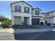 Two-story house with stone accents and a two-car garage at 5131 E Gallop Way, Scottsdale, AZ 85254