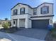 Two-story home with stone accents and a two-car garage at 5131 E Gallop Way, Scottsdale, AZ 85254