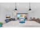 Open kitchen with island, looking towards living room and pool at 5316 E Thomas Rd, Phoenix, AZ 85018