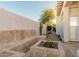 Landscaped backyard with cactus and stone pathway at 7538 E Tuckey Ln, Scottsdale, AZ 85250