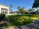 Landscaped lawn area with views of community buildings at 7538 E Tuckey Ln, Scottsdale, AZ 85250