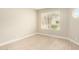 Spacious bedroom featuring a window and tile floors at 8351 W Taro Ln, Peoria, AZ 85382