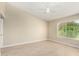 Well-lit bedroom with ceiling fan and tile flooring at 8351 W Taro Ln, Peoria, AZ 85382