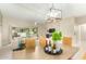 Bright dining area with a wood table and wicker chairs at 8351 W Taro Ln, Peoria, AZ 85382