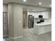 Modern kitchen with white cabinets, stainless steel appliances, and a large island at 8351 W Taro Ln, Peoria, AZ 85382