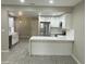 Updated kitchen, white cabinets, stainless steel appliances, and a farmhouse sink at 8351 W Taro Ln, Peoria, AZ 85382