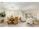 Open living and dining area with tile floors and neutral decor at 8351 W Taro Ln, Peoria, AZ 85382