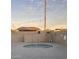Relaxing community spa with brick walls and seating at 9427 E University Dr # 46, Mesa, AZ 85207