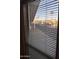 View of the community from a window, showing palm trees and homes at 9427 E University Dr # 46, Mesa, AZ 85207