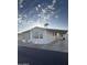 Side view of manufactured home showcasing parking and landscaping at 9427 E University Dr # 46, Mesa, AZ 85207