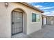 Front entrance with arched entryway and security door at 9523 W North Ln # B, Peoria, AZ 85345