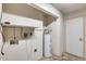 Laundry room with water heater and shelving at 9523 W North Ln # B, Peoria, AZ 85345