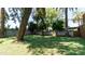 Large backyard with grassy area and mature trees at 1011 W Northern Ave, Phoenix, AZ 85021