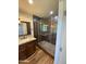 Bathroom with a large walk-in shower and pebble floor at 1011 W Northern Ave, Phoenix, AZ 85021