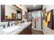 Bathroom with double vanity, granite countertop, and large mirror at 1011 W Northern Ave, Phoenix, AZ 85021