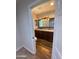 Double vanity bathroom with dark wood cabinets and granite countertops at 1011 W Northern Ave, Phoenix, AZ 85021