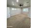 Bright bedroom with ceiling fan, carpet, and window with shutters at 1011 W Northern Ave, Phoenix, AZ 85021