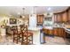 Open concept kitchen with island seating and stainless steel appliances at 1011 W Northern Ave, Phoenix, AZ 85021
