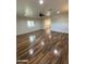 Living room with wood-look tile flooring and ceiling fan at 1011 W Northern Ave, Phoenix, AZ 85021