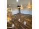 Large living room with wood-look tile flooring and ceiling fan at 1011 W Northern Ave, Phoenix, AZ 85021