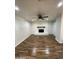 Living room with hardwood floors, a fireplace, and neutral walls at 1011 W Northern Ave, Phoenix, AZ 85021