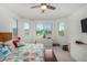 Main bedroom with a large bed, ceiling fan, and ample natural light at 12667 E Nandina Pl, Gold Canyon, AZ 85118