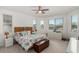 Bright and airy bedroom with a king-size bed and large windows offering natural light at 12667 E Nandina Pl, Gold Canyon, AZ 85118