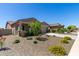 Charming house with a landscaped yard, driveway, and attractive curb appeal at 12667 E Nandina Pl, Gold Canyon, AZ 85118