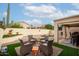 Covered patio, artificial turf, and sitting area at 13958 W Paiute Trl, Surprise, AZ 85374