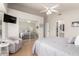 Main bedroom with mirrored closet doors and access to bathroom at 13958 W Paiute Trl, Surprise, AZ 85374