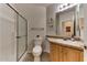 Clean bathroom with a shower, toilet and wood vanity at 17200 W Bell Rd # 1218, Surprise, AZ 85374