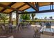 Relaxing community patio overlooking a pond and golf course at 17200 W Bell Rd # 1218, Surprise, AZ 85374