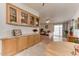 Bright dining area with built-in cabinetry and view into living room at 17200 W Bell Rd # 1218, Surprise, AZ 85374
