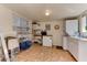 Functional laundry room with storage and a small refrigerator at 17200 W Bell Rd # 1218, Surprise, AZ 85374