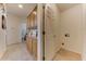 Convenient laundry room with built-in storage and a closet at 17200 W Bell Rd # 1218, Surprise, AZ 85374