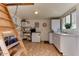 Laundry room with washer, dryer, shelving, and mini-fridge at 17200 W Bell Rd # 1218, Surprise, AZ 85374