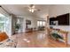 Spacious living room with hardwood floors and access to a balcony at 17200 W Bell Rd # 1218, Surprise, AZ 85374