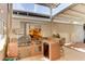 Outdoor kitchen with built-in grill, sink, and mini-fridge at 17200 W Bell Rd # 1218, Surprise, AZ 85374