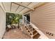 Brick patio with pergola, seating area, and steps leading to home at 17200 W Bell Rd # 1218, Surprise, AZ 85374