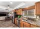 Spacious kitchen with granite countertops and stainless steel appliances at 17434 N Conquistador Dr, Sun City West, AZ 85375